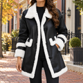 Black womens faux shearling coat worn on a Washington DC street.