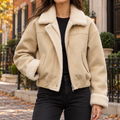 Apricot womens faux suede bomber jacket worn on a Washington DC street.