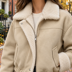 Close-up of the womens faux suede bomber jacket collar and fabric texture.