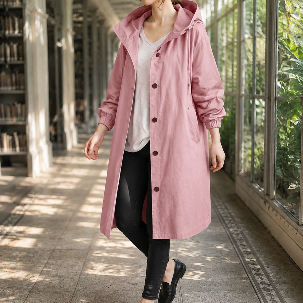 Pink hooded overcoat with a button front on a model.