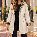 Beige trench coat worn on a Washington DC street.