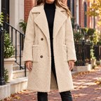 Cream overcoats worn on a Washington DC street.