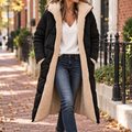 Black quilted coat with cream fleece lining worn on a Washington DC street.