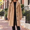 Beige overcoats worn on a Washington DC street.