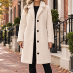 Cream overcoats worn on a Washington DC street.