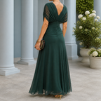Rear full length view of dark green draped maxi dress