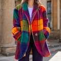 Multicolor plaid longline jacket with oversized shape worn over a purple top.