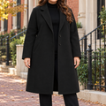 Black overcoats worn on a Washington DC street.
