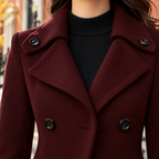 Close-up of the trench coat showing the collar and fabric texture.