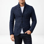 Overcoat in Navy showing the buttoned front and classic longline shape