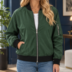 Woman wearing the zip bomber jacket in dark green