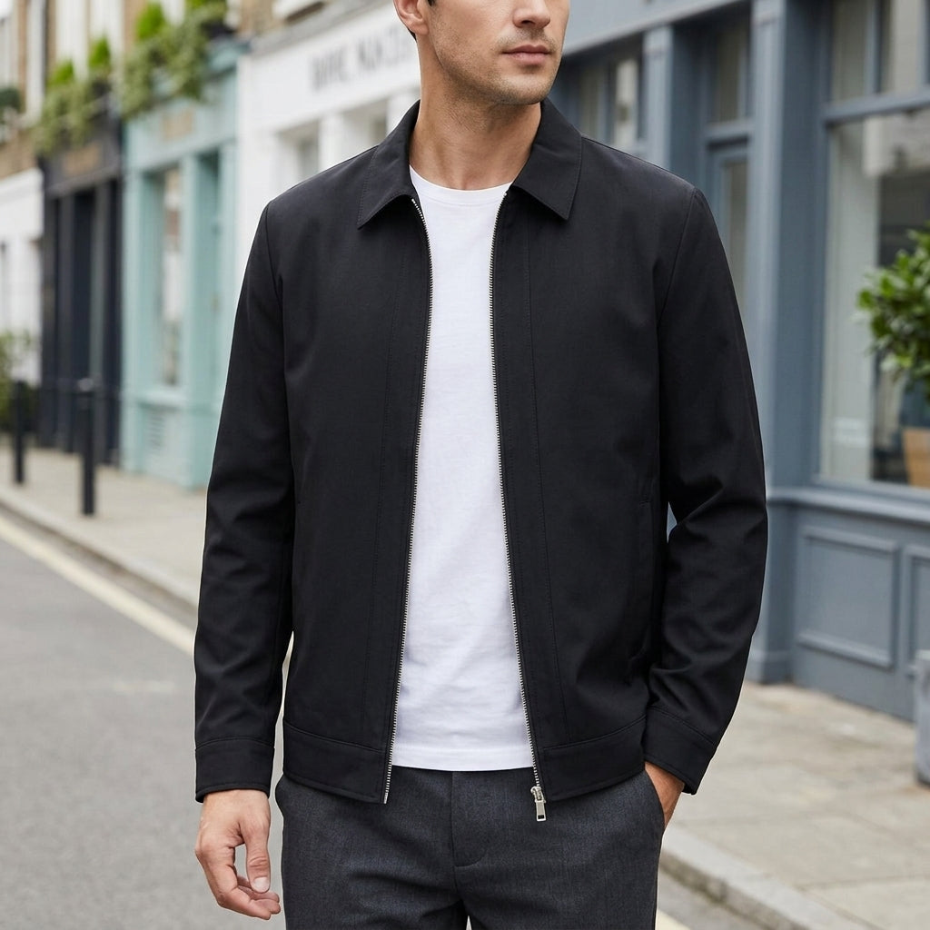 Zip Jacket in Black showing the pointed collar and full-length zip